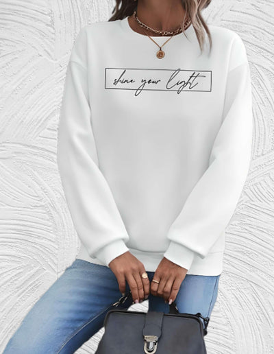 Velanora- Oversized sweater met ronde hals en 'share your light'-statement op de voorkant